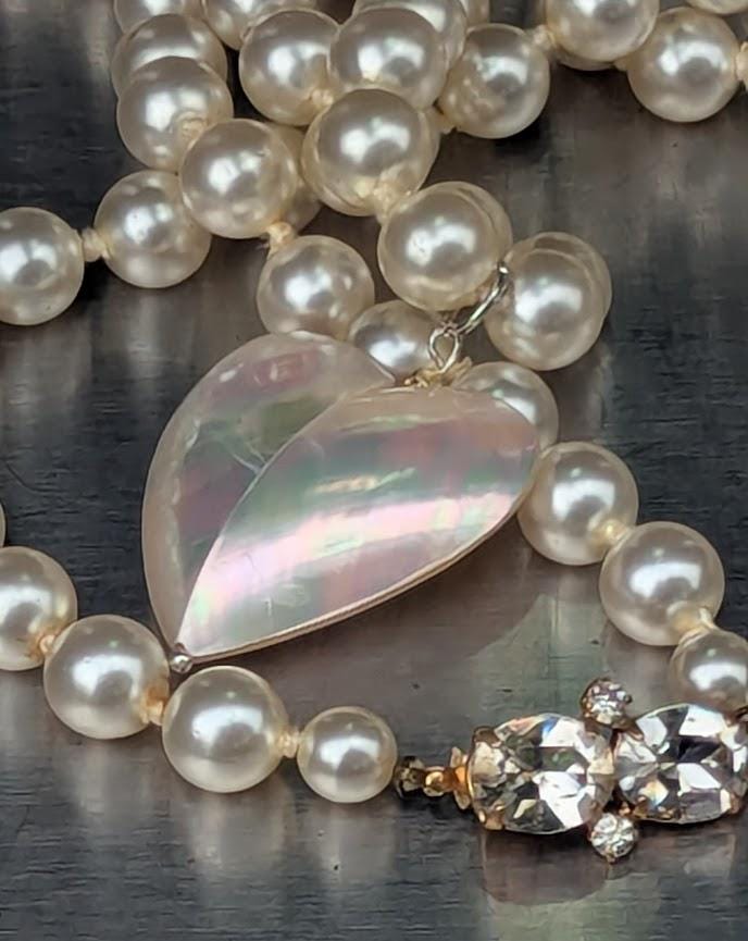 Pearl strand, bright white, 60 inches long, with a mother-of-pearl heart pendant, Decorative CZ closure. Can be wrapped one or two times