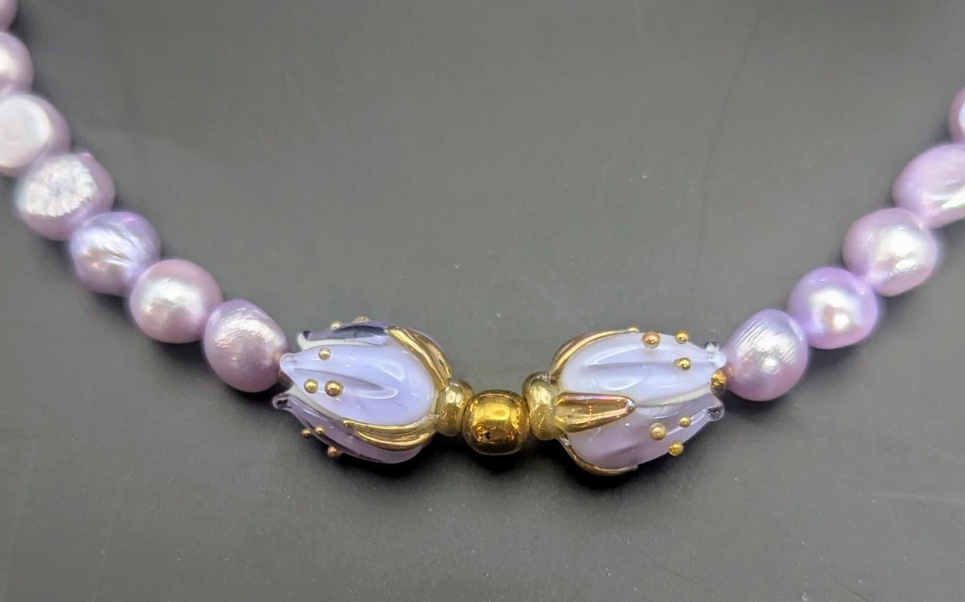 Violet Freshwater Pearl Choker with floral centerpiece.