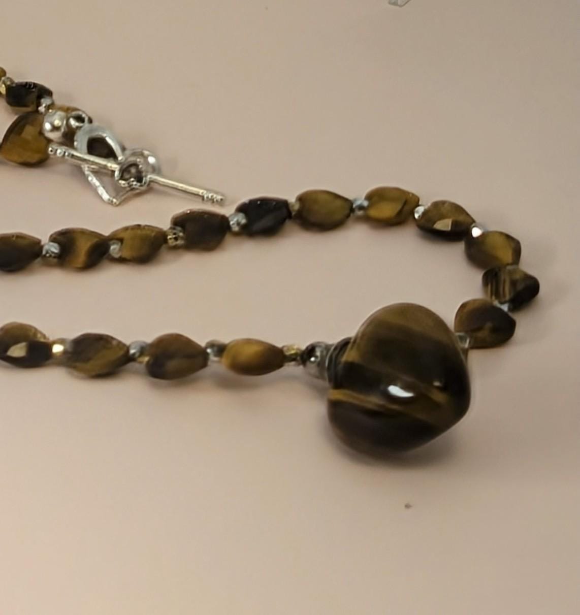 Heart shaped perfume bottle necklace made of Tiger Eye gems