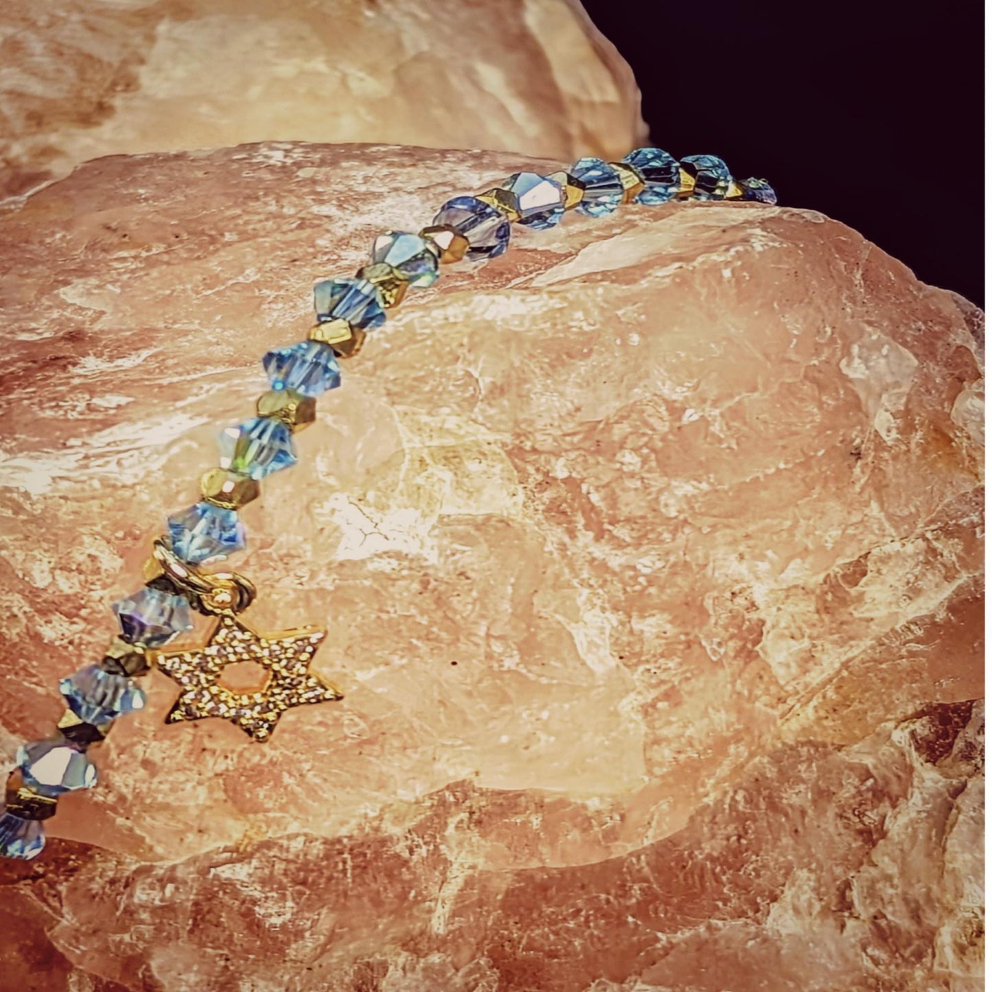 Dainty Star of David on a chain of blue crystals and sparkling gold accents