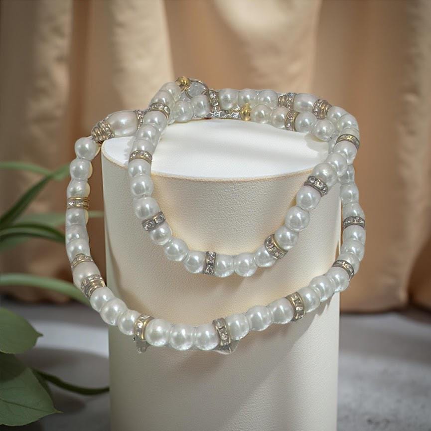 Elegant pearl necklace with vintage gold beads covered in sparkling rhinestones. 20 inches in length.