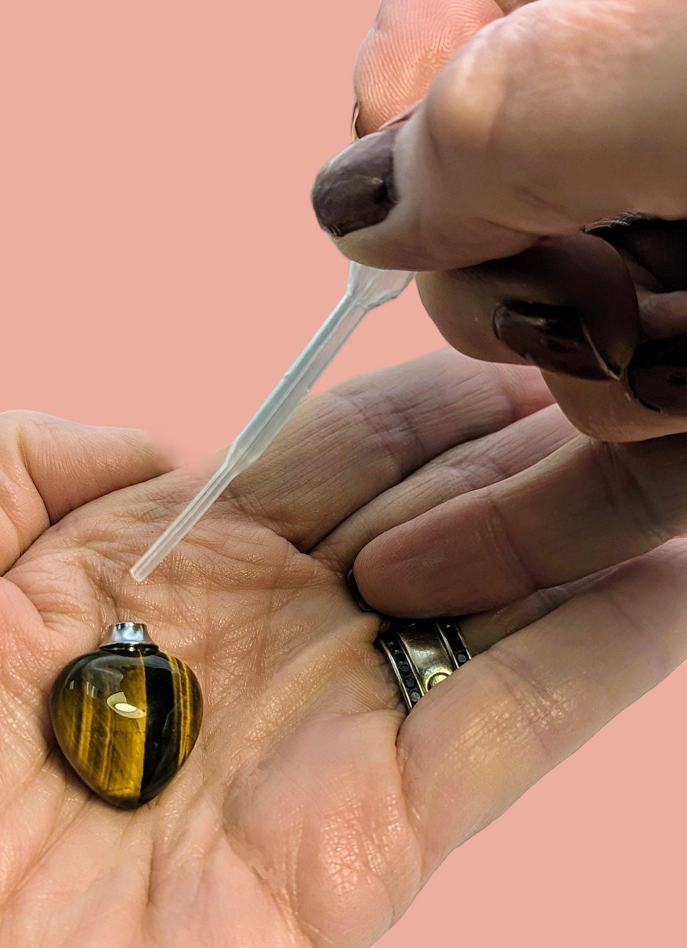 Heart shaped perfume bottle necklace made of Tiger Eye gems