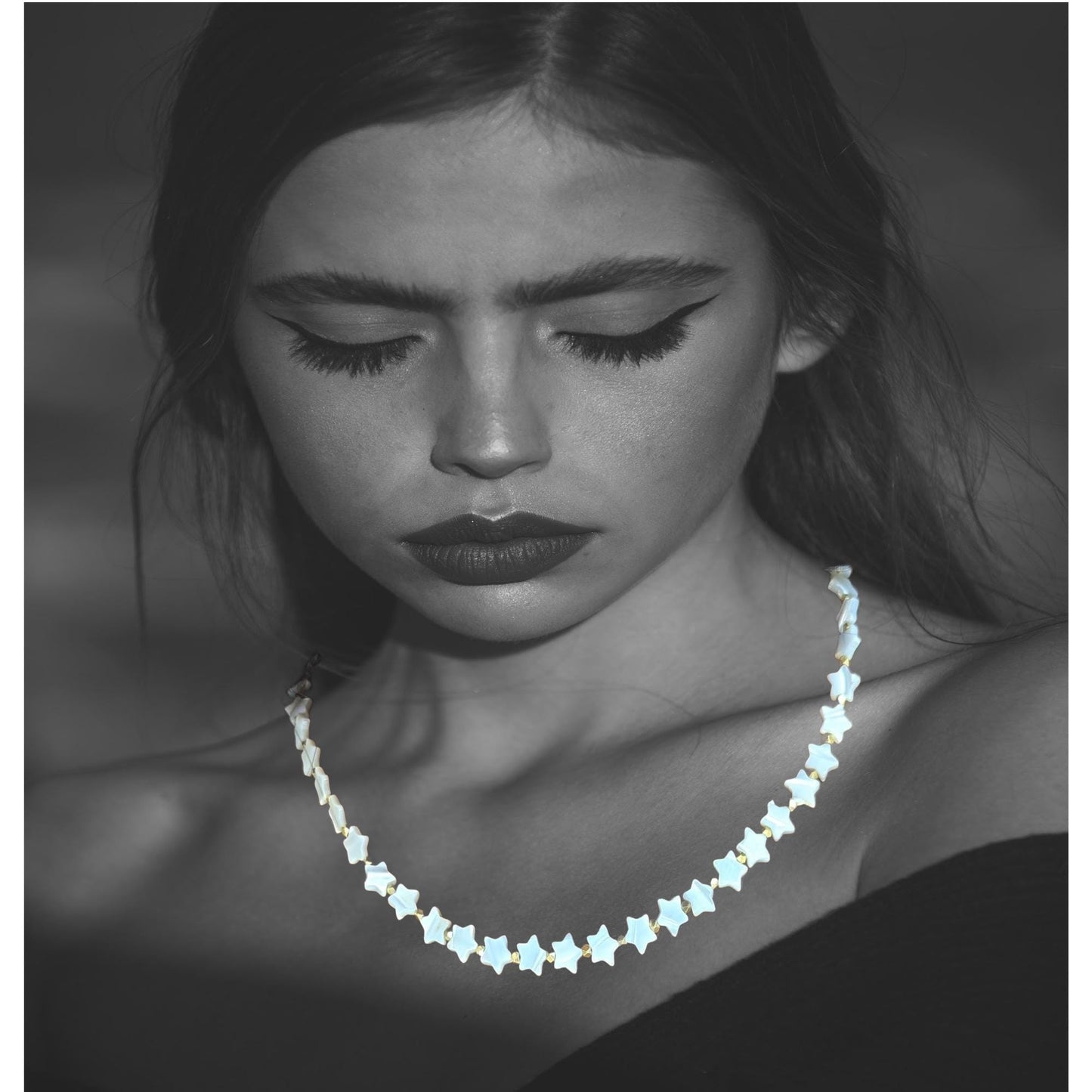 Mother-of-Pearl strand of stars. 18 inches in length. Great layering necklace