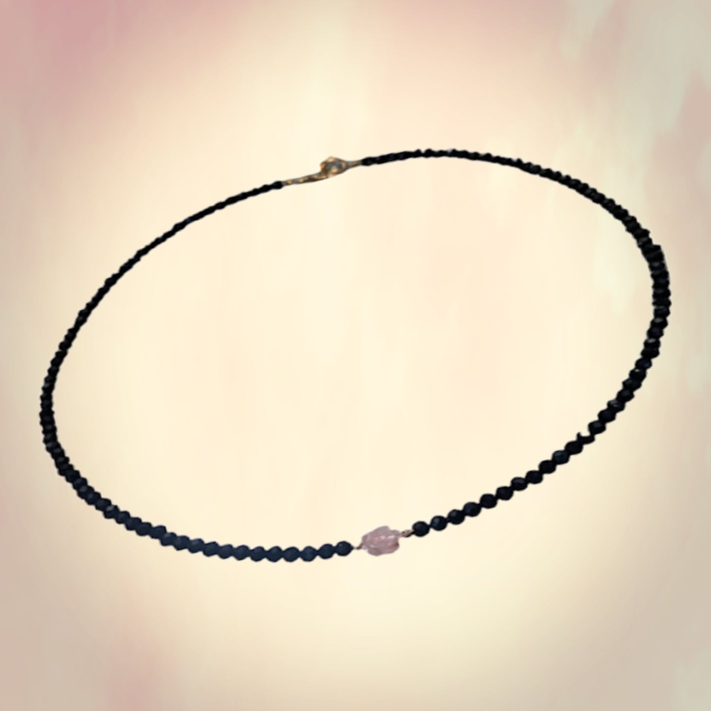Pink Mother of Pearl Rose centered on Sparkling Black Crystals.