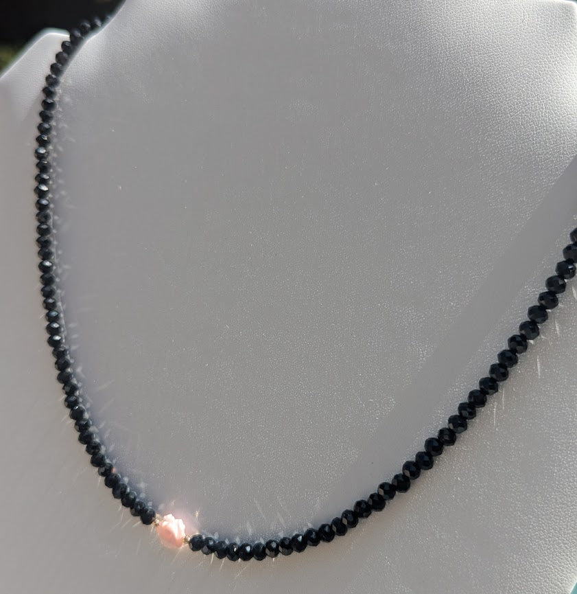 Pink Mother of Pearl Rose centered on Sparkling Black Crystals.