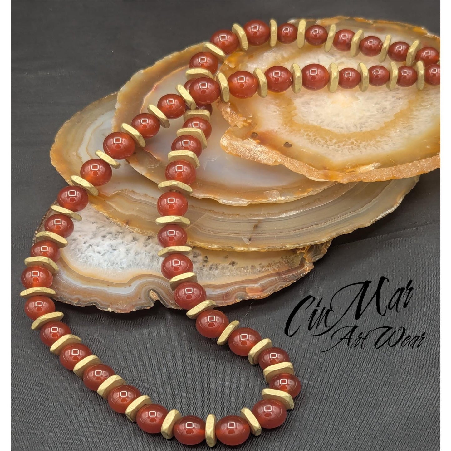 Carnelian beads surrounded by brushed gold squares