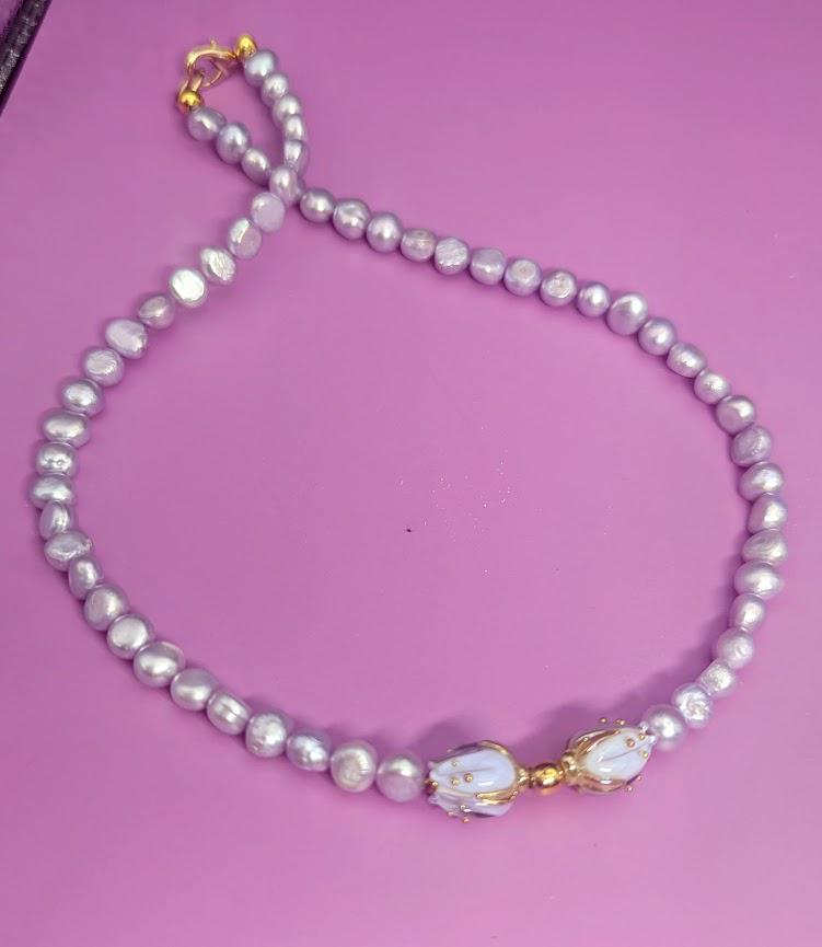 Violet Freshwater Pearl Choker with floral centerpiece.