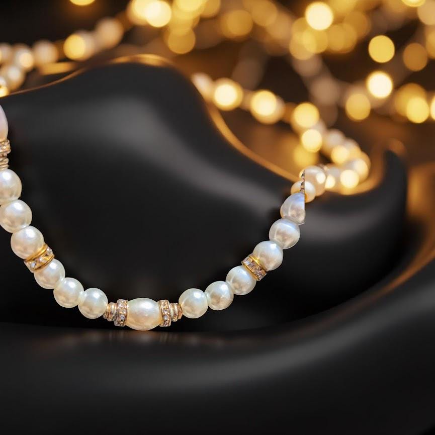 Elegant pearl necklace with vintage gold beads covered in sparkling rhinestones. 20 inches in length.