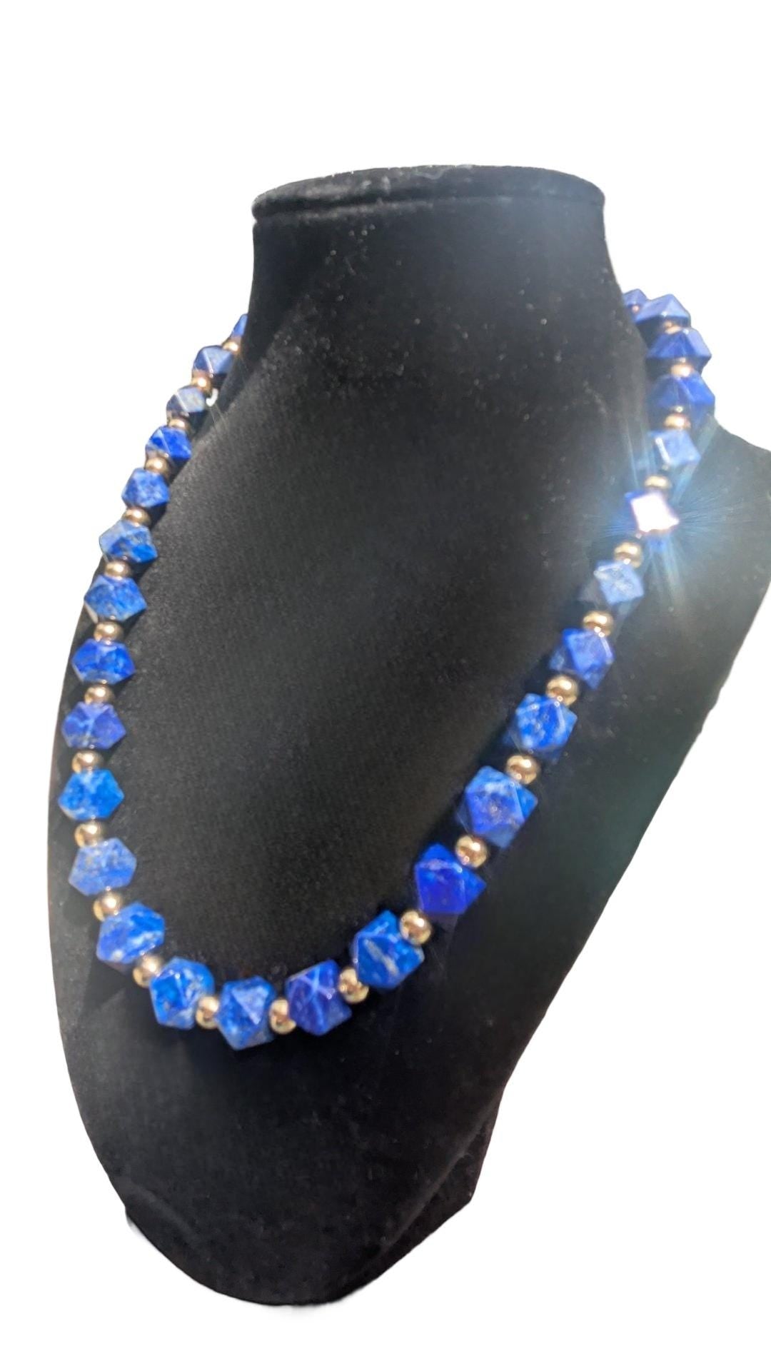 Lapis Lazuli Necklace. The square Lapis beads are faceted and interspersed with sparkling silver cubes. It's 21 inches in length.