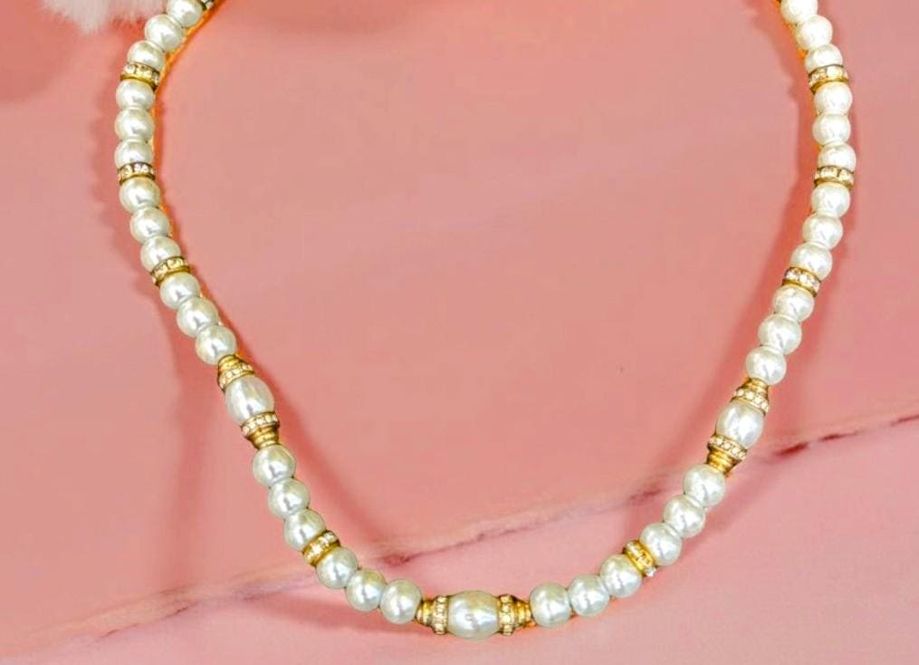 Elegant pearl necklace with vintage gold beads covered in sparkling rhinestones. 20 inches in length.