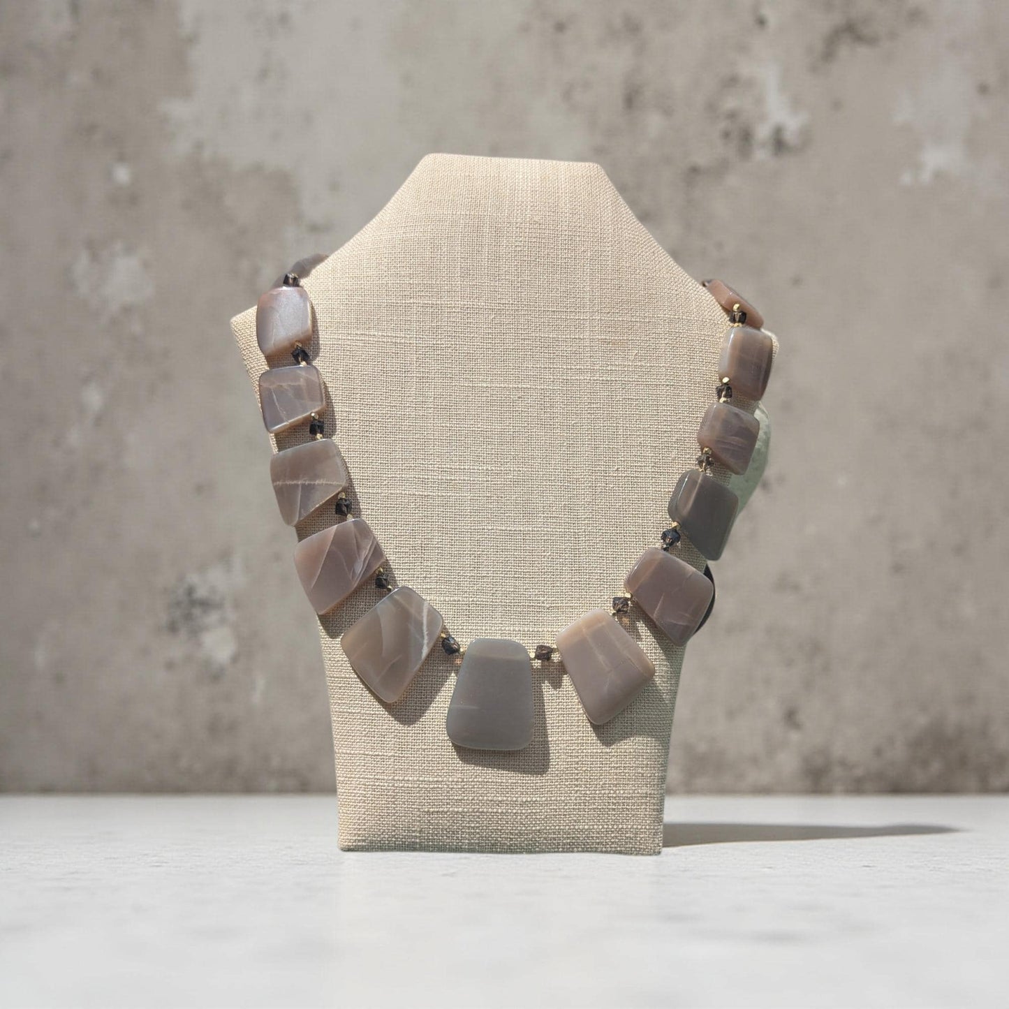 Taupe moon stone necklace accented with smoky topaz and gold.
