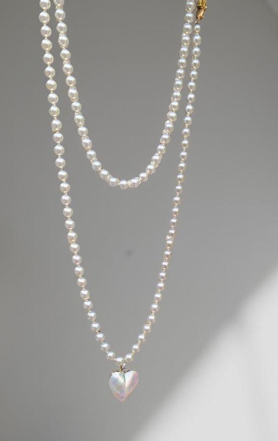 Pearl strand, bright white, 60 inches long, with a mother-of-pearl heart pendant, Decorative CZ closure. Can be wrapped one or two times
