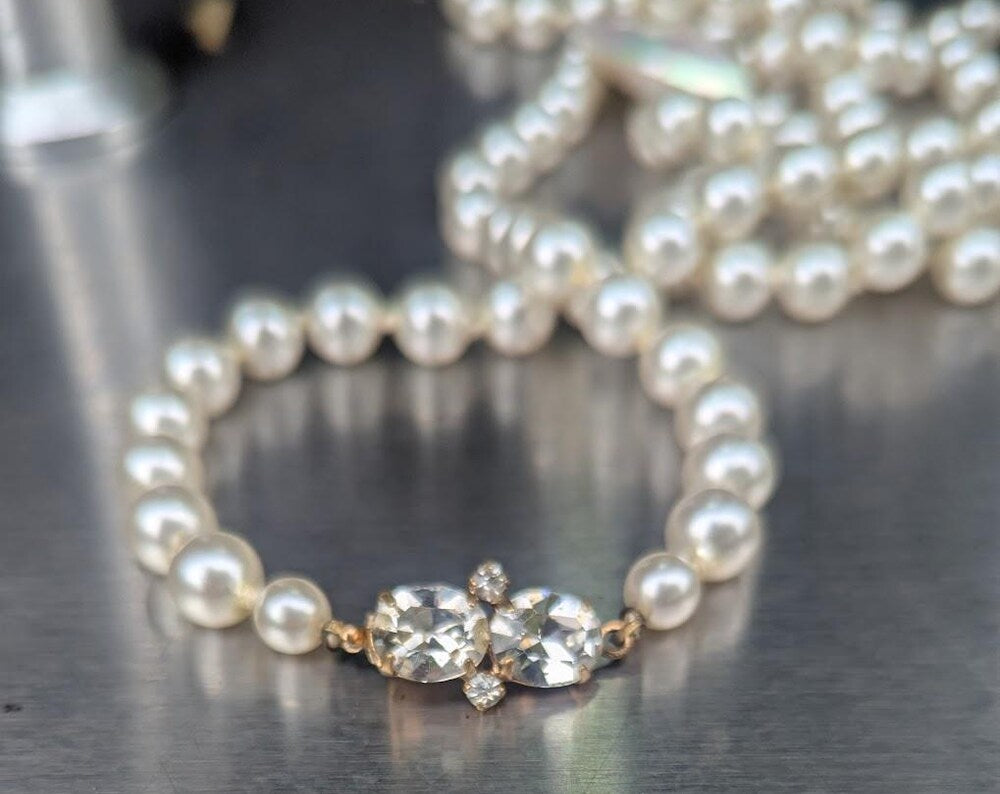 Pearl strand with heart pendant