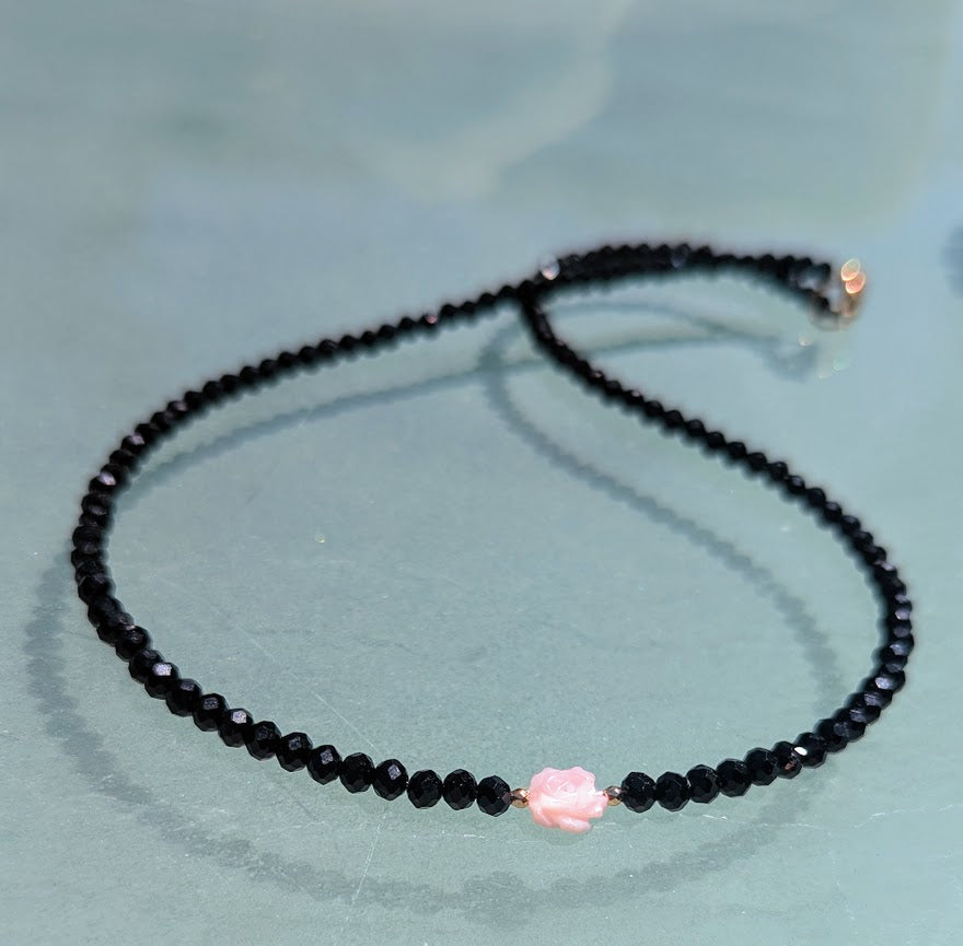 Pink Mother of Pearl Rose centered on Sparkling Black Crystals.