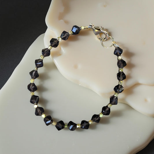 Smoky Topaz bracelet.  The topaz beads are faceted interspersed with faceted gold beads for extra sparkle.