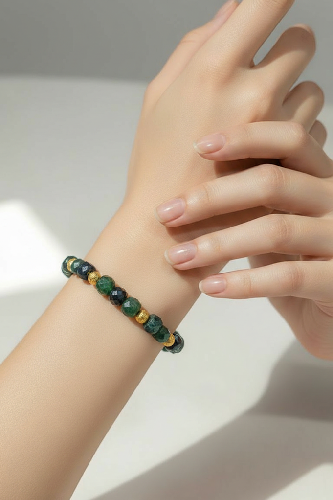 Green faceted cubed beaded bracelet trimmed in sparkling gold
