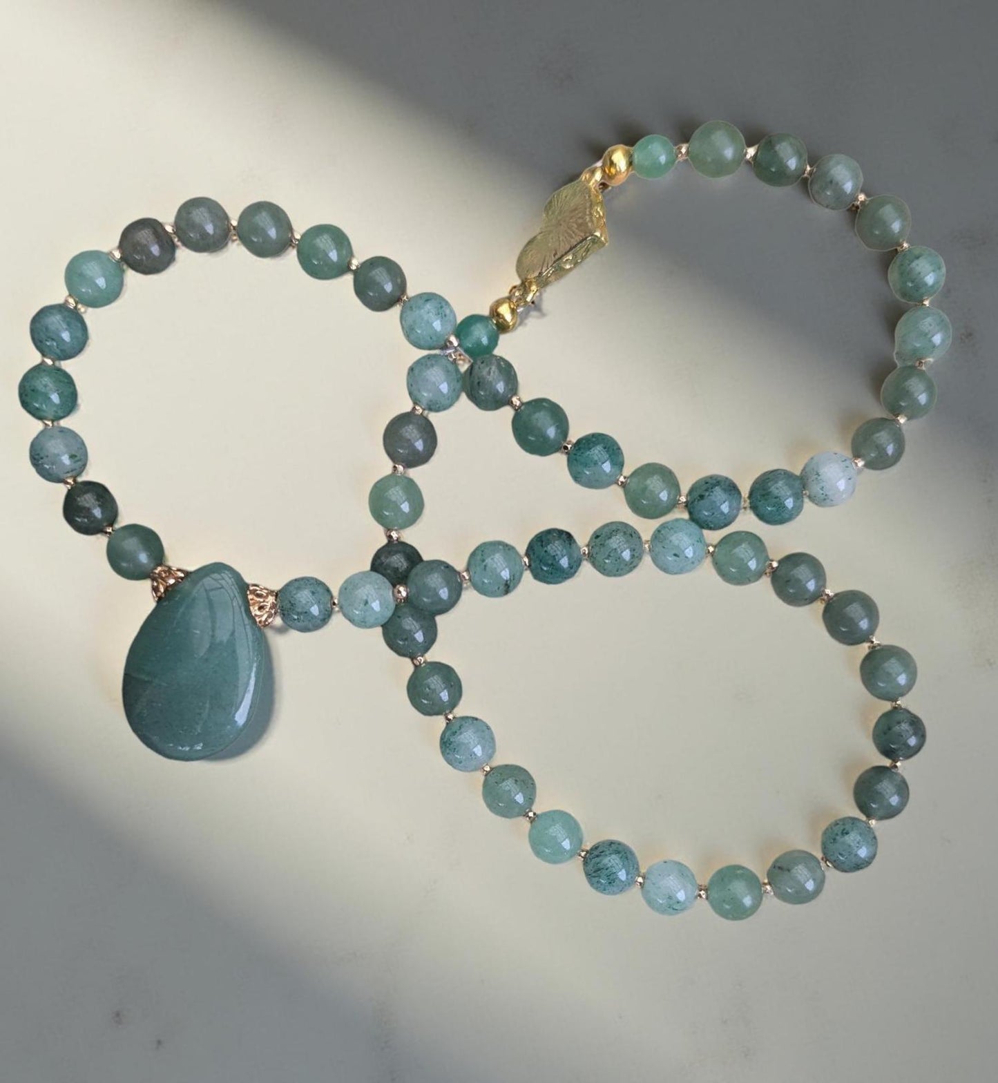Jade Necklace, vibrant green rounded beads with a jade teardrop focal. A must-have for Jade lovers.