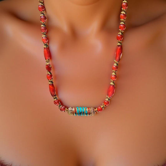 Carnelian necklace with Tibetan focal bead that is trimmed in turquoise.