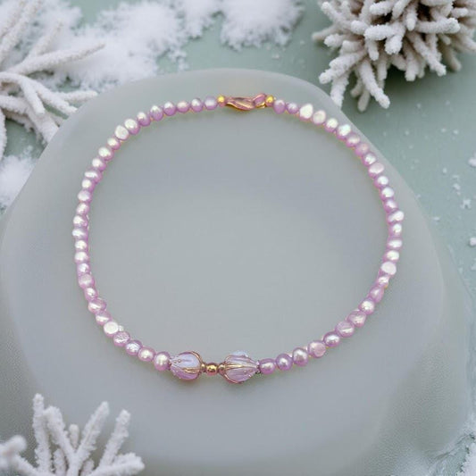 Violet Freshwater Pearl Choker with floral centerpiece.