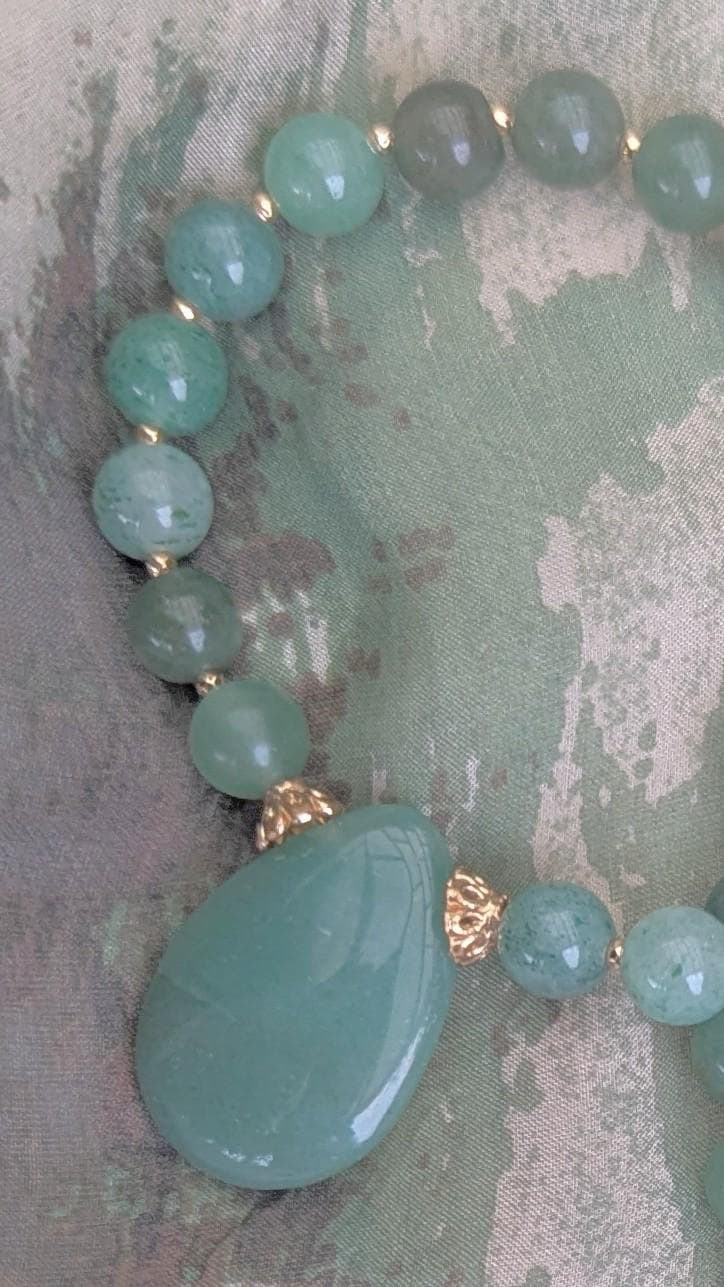 Jade Necklace, vibrant green rounded beads with a jade teardrop focal. A must-have for Jade lovers.