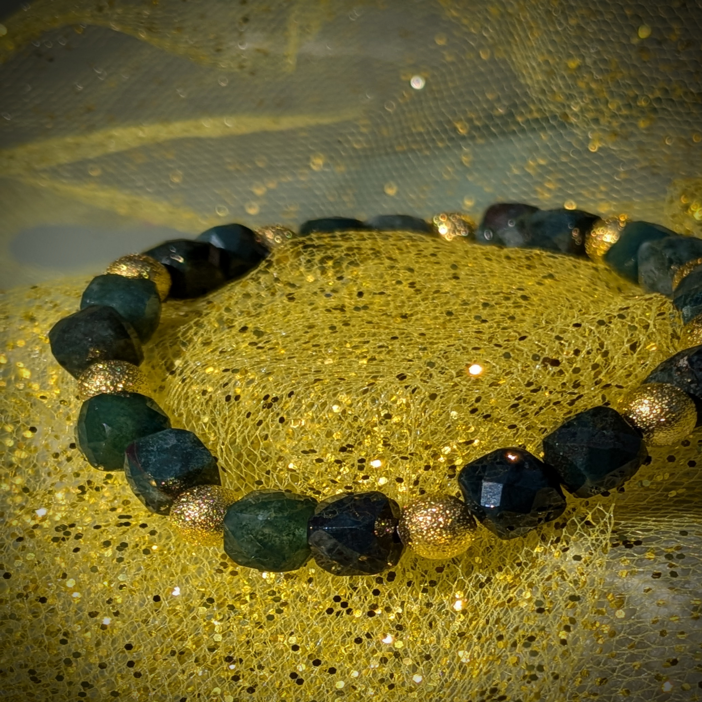 Green faceted cubed beaded bracelet trimmed in sparkling gold