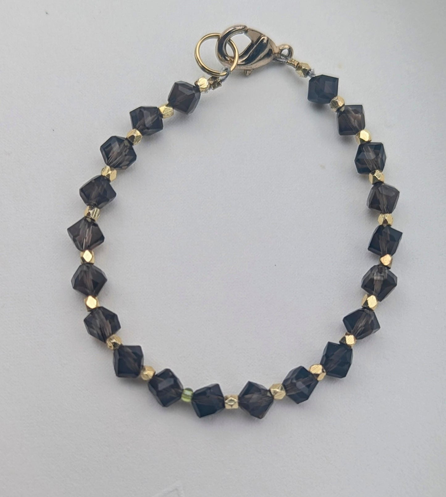 Smoky Topaz bracelet.  The topaz beads are faceted interspersed with faceted gold beads for extra sparkle.