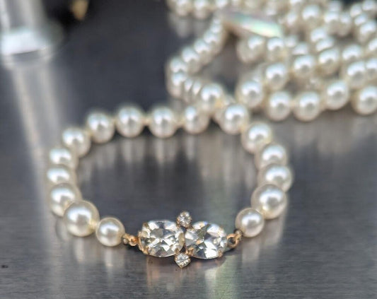 Pearl strand with heart pendant