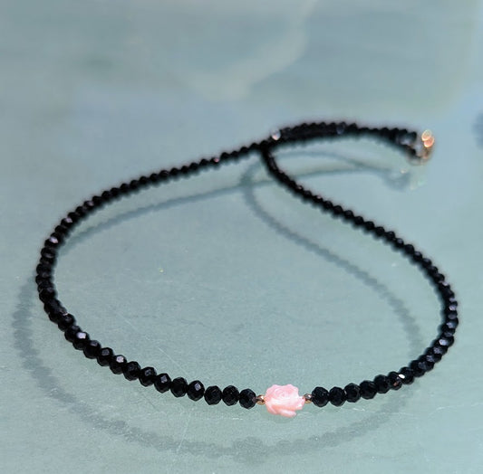 Pink Mother of Pearl Rose centered on Sparkling Black Crystals.