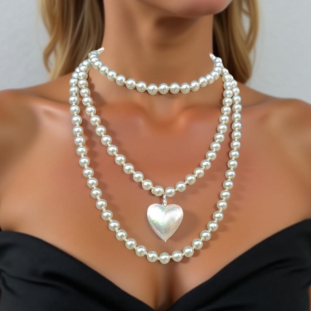Pearl strand with heart pendant