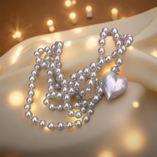 Pearl strand with heart pendant