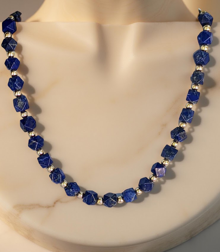 Faceted Lapis Cube Necklace with gold-tone accents. 21 inches in length