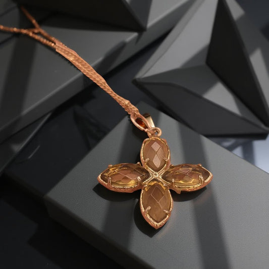 Delicate crystal pendant on a double chain. The crystal pendant is a translucent golden color.