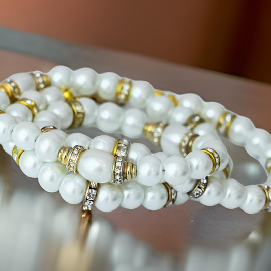 Elegant pearl necklace with vintage gold beads covered in sparkling rhinestones.  20 inches in length.